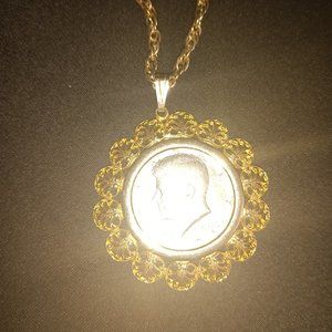 Collector find vintage JFK half dollar in gold plated coin holder